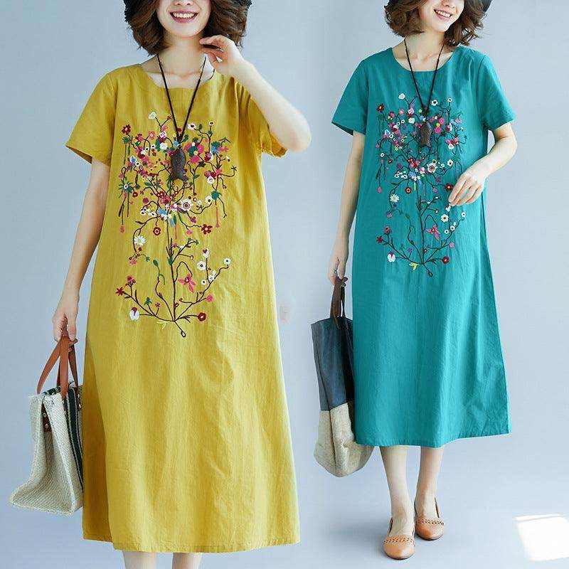 Ethnic style embroidered medium length cotton linen dress in yellow and green colors with floral patterns and comfortable fabric.