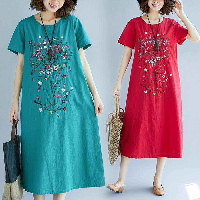 Women wearing ethnic style embroidered cotton linen medium length dresses in green and red colors