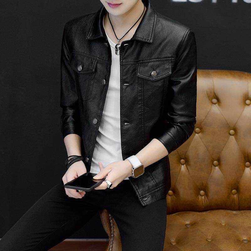 Men's black motorcycle leather jacket with button front and chest pockets, styled casually